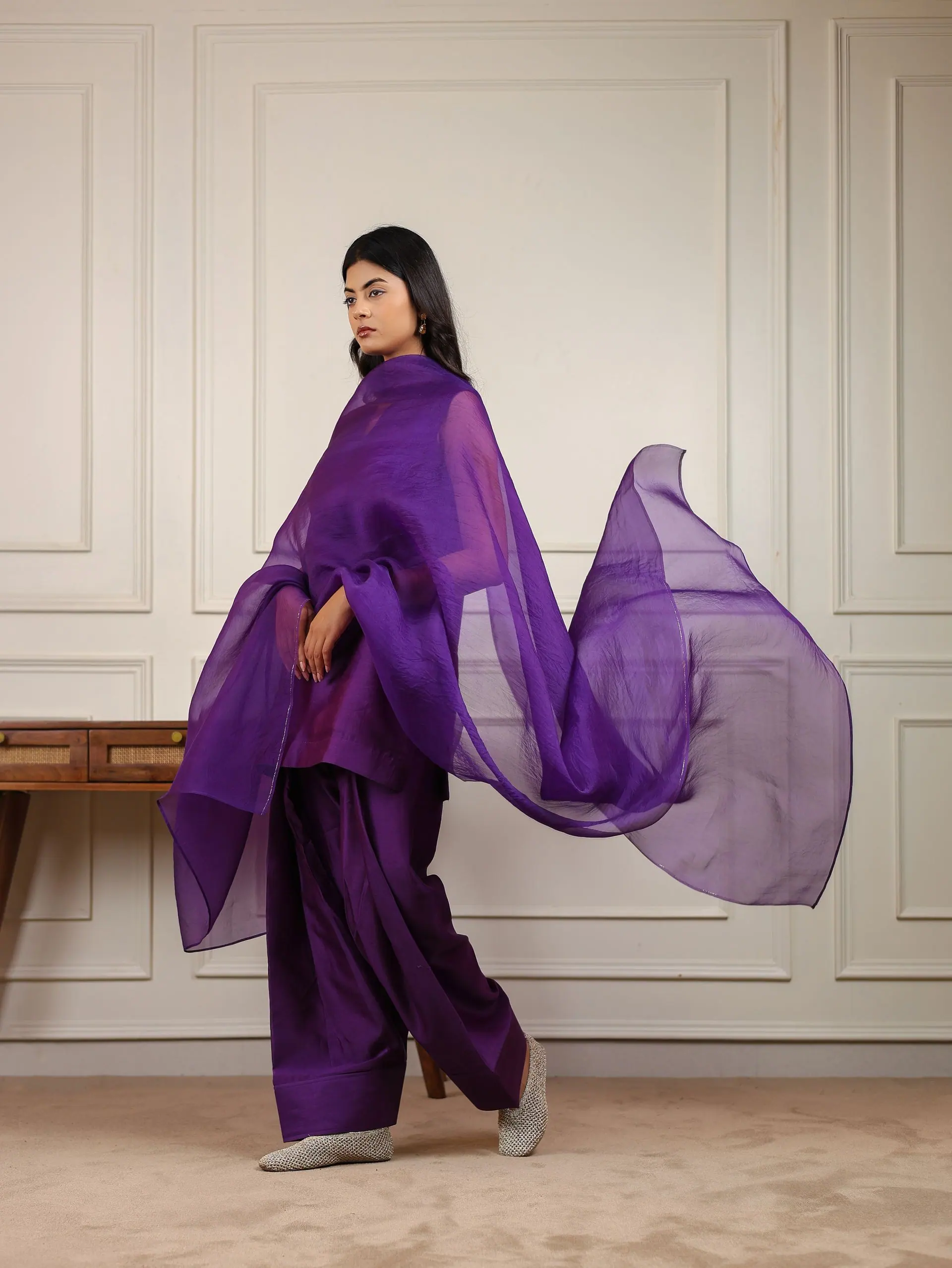 Aubergine silk Farsi suit with organza dupatta sweeping behind