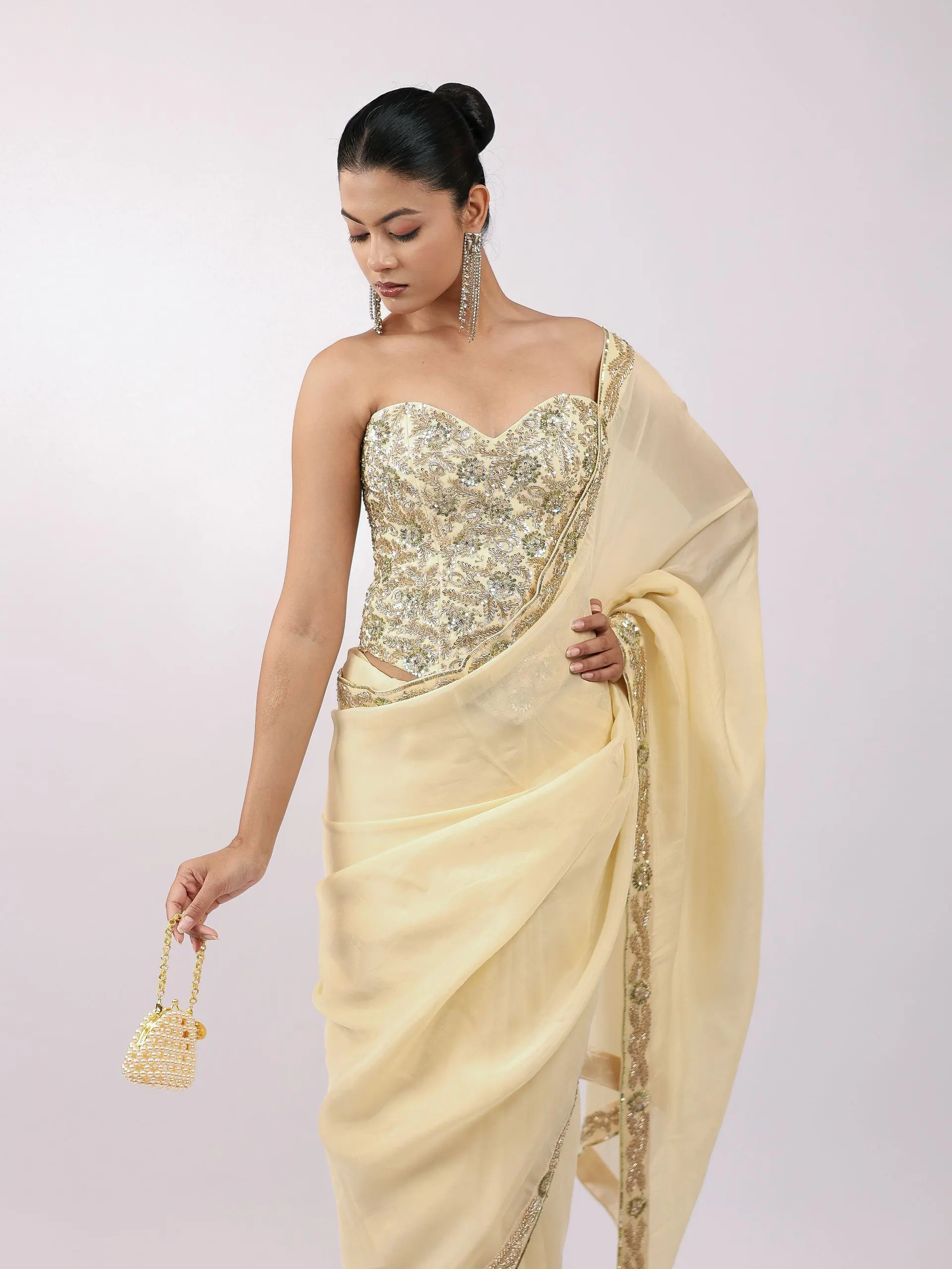 Embroidered corset with buttercream drape, waist-up