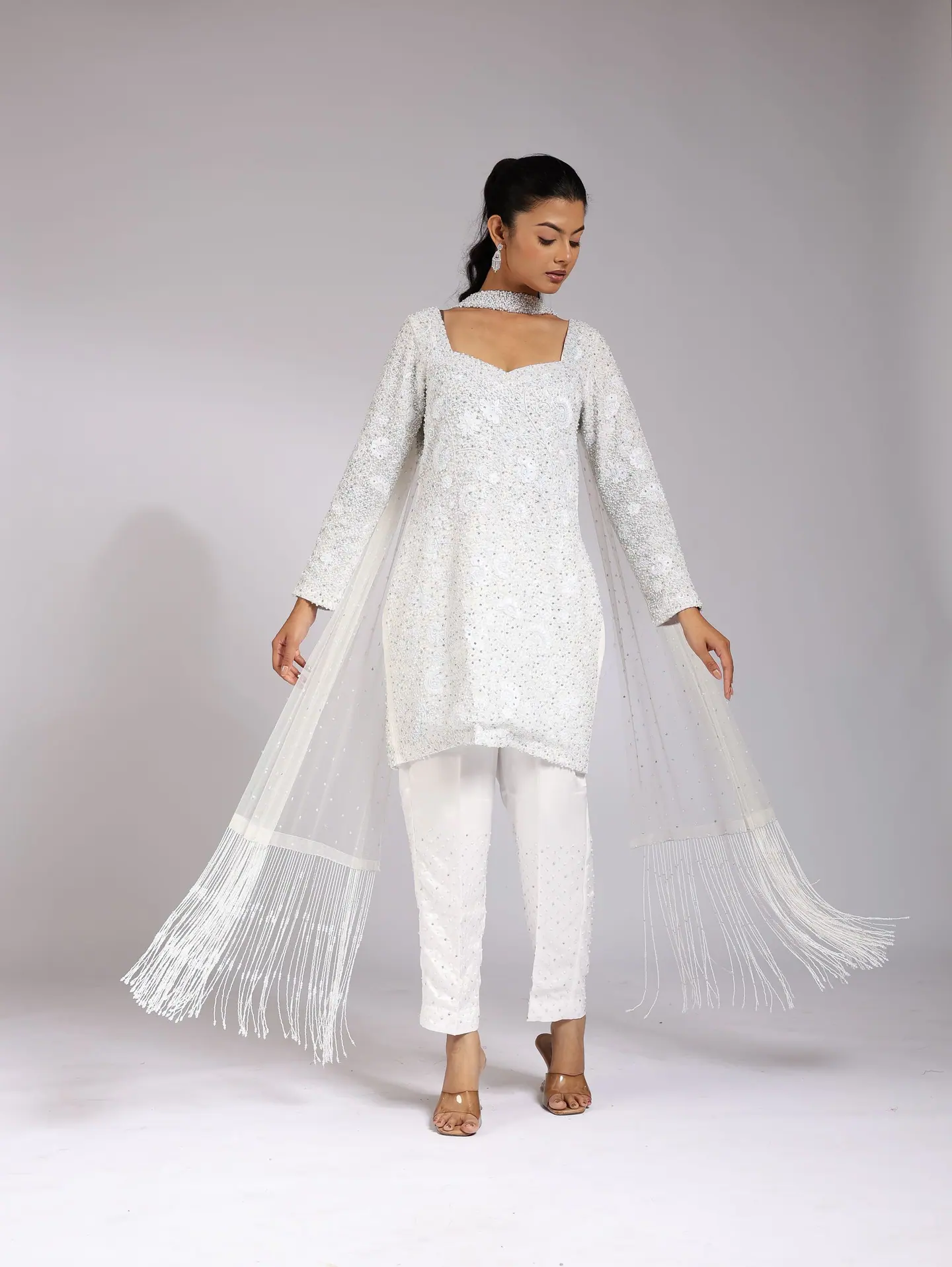 White chikankari kurta set with the dupatta spread wide