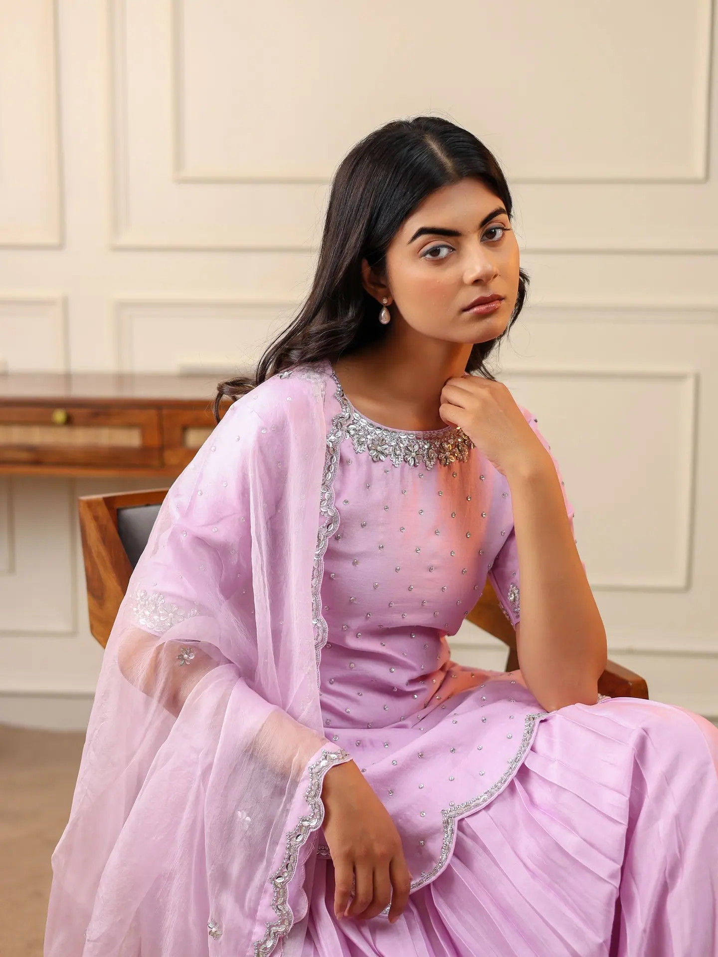 Lilac anarkali, chin resting on hand