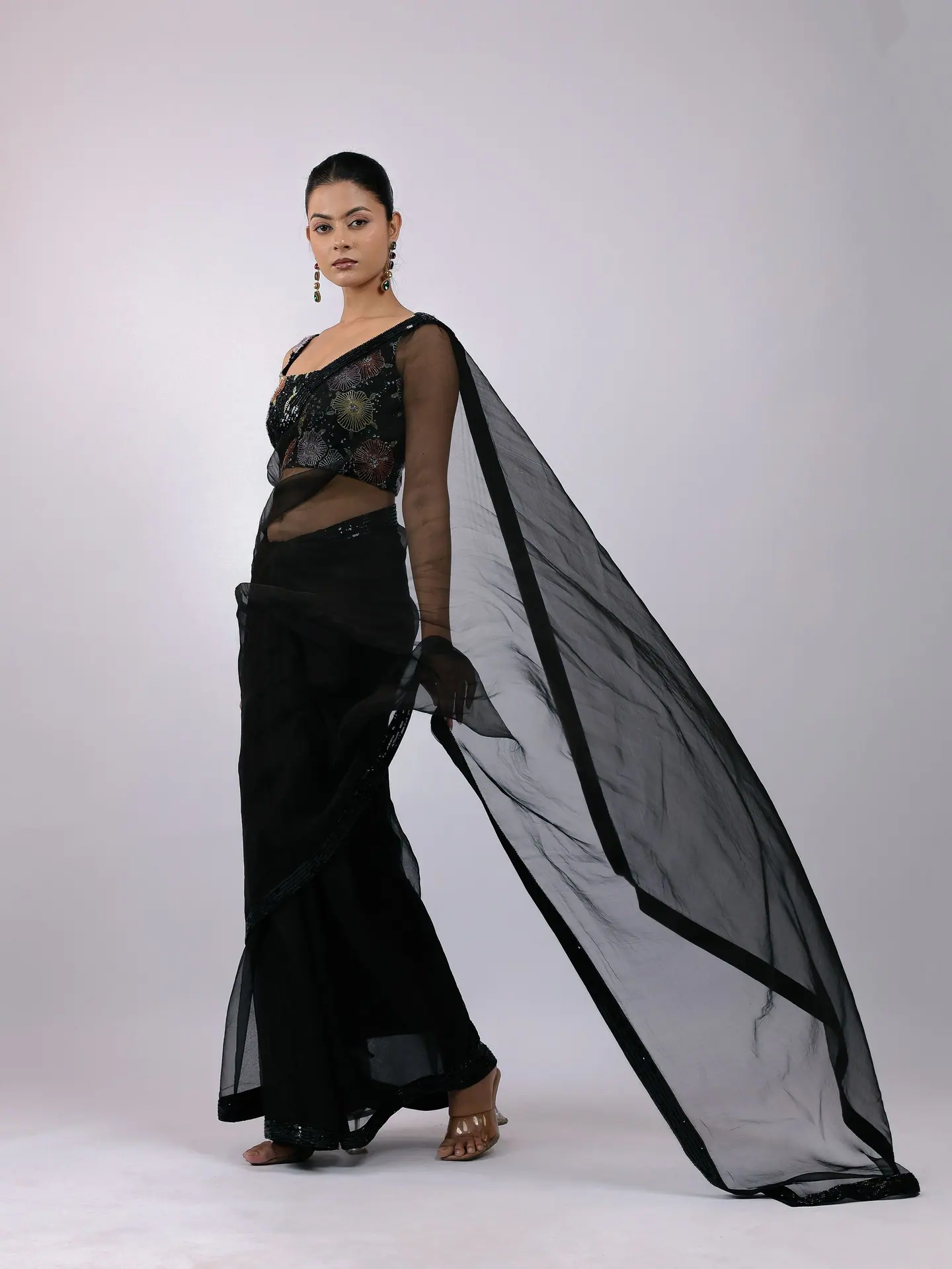 Black sheer pallu swept out to the side