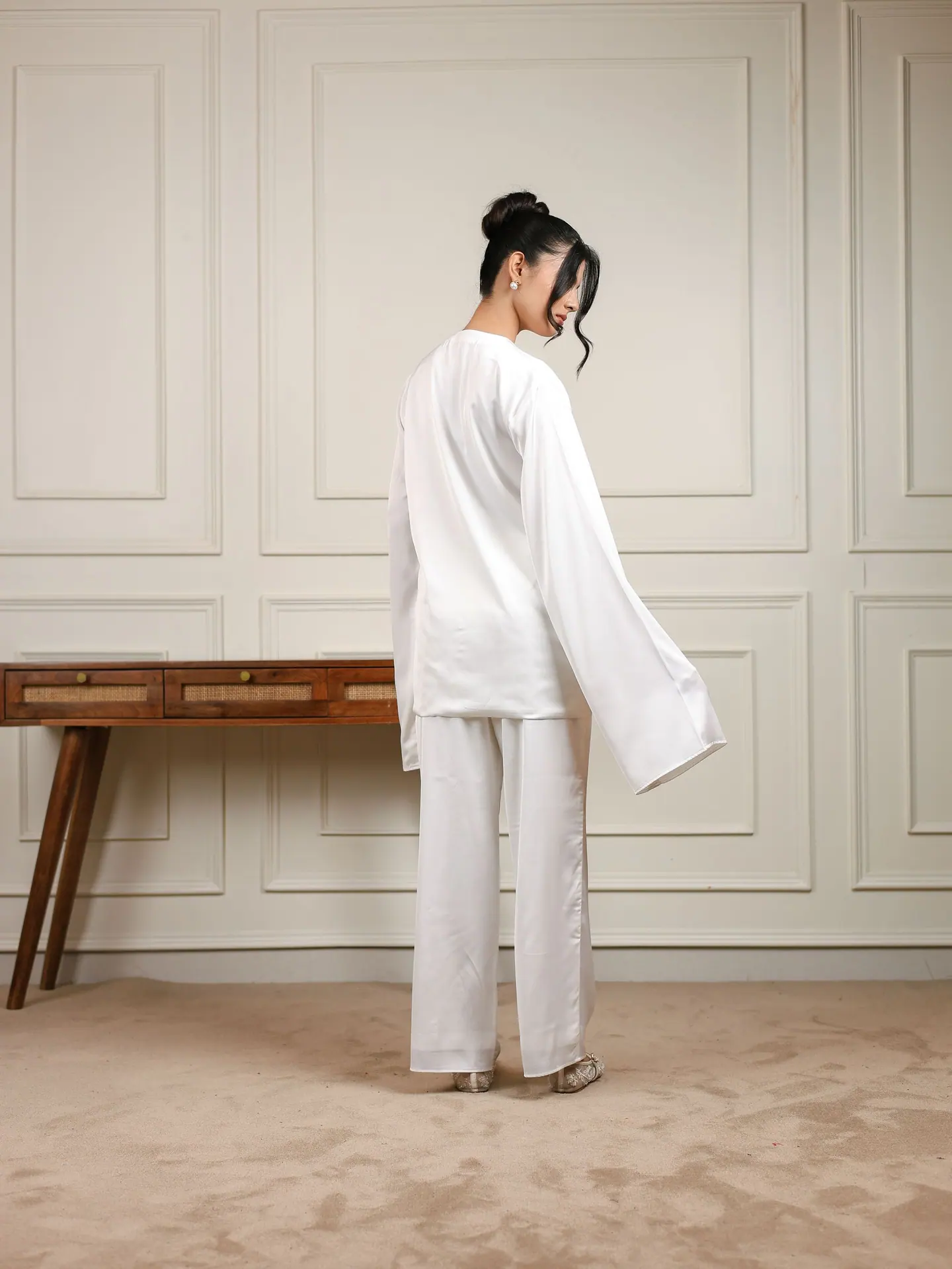White satin shirt with wide sleeves and straight pants, full length
