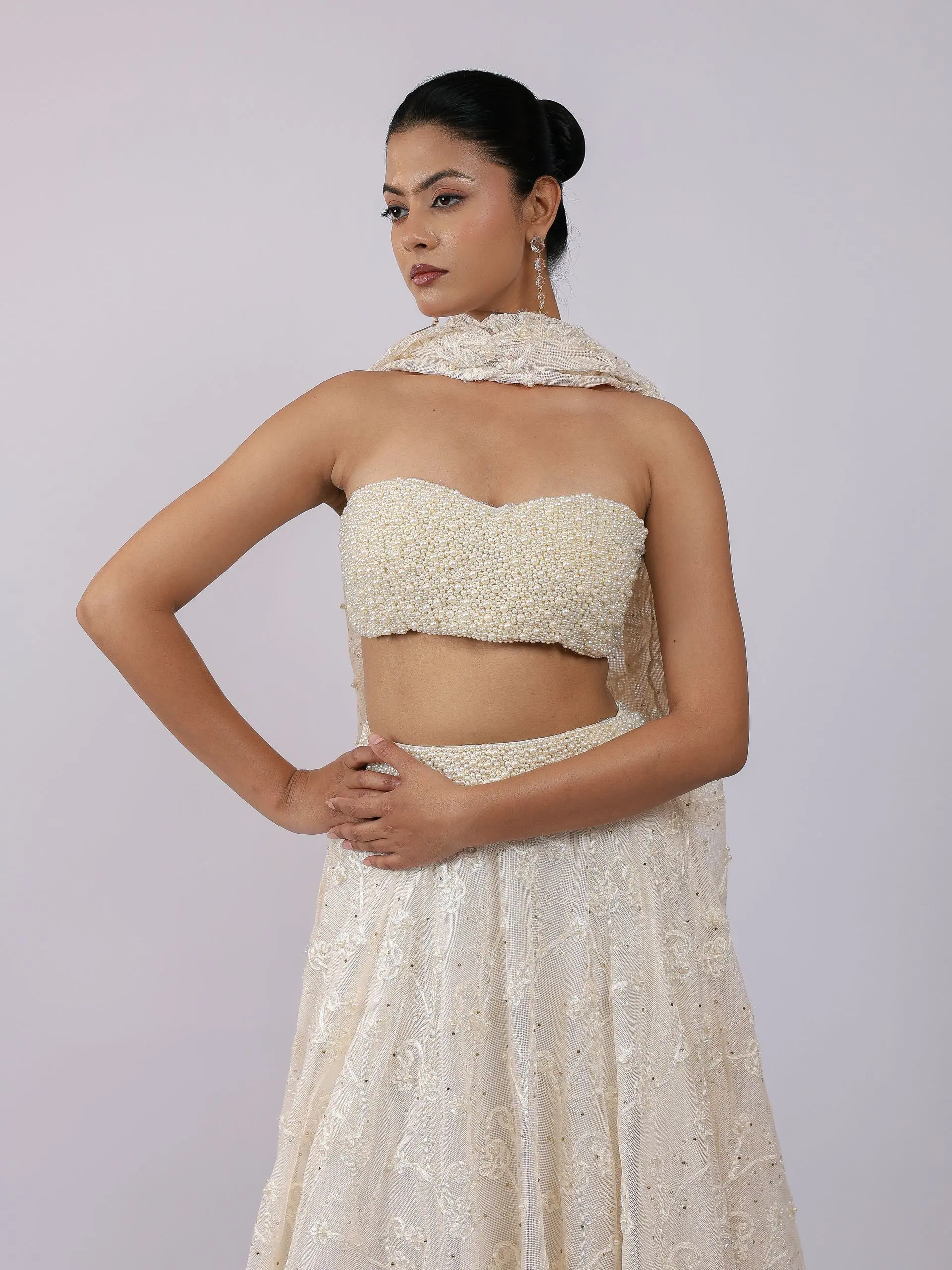 Ivory pearl bustier and lehenga, waist-up